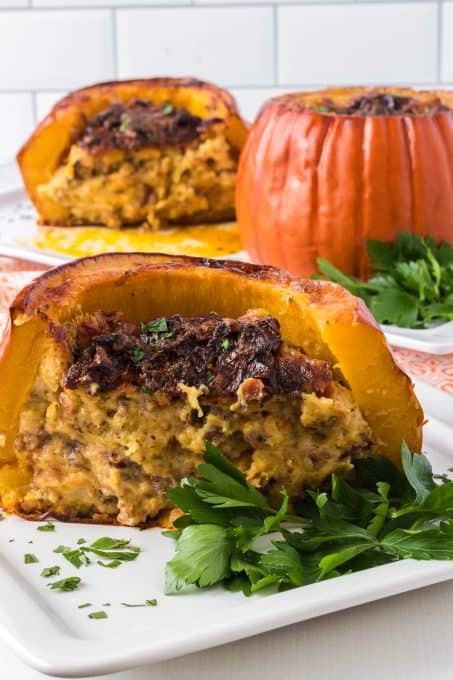 The inside of a sausage and cornbread stuffed pumpkin.