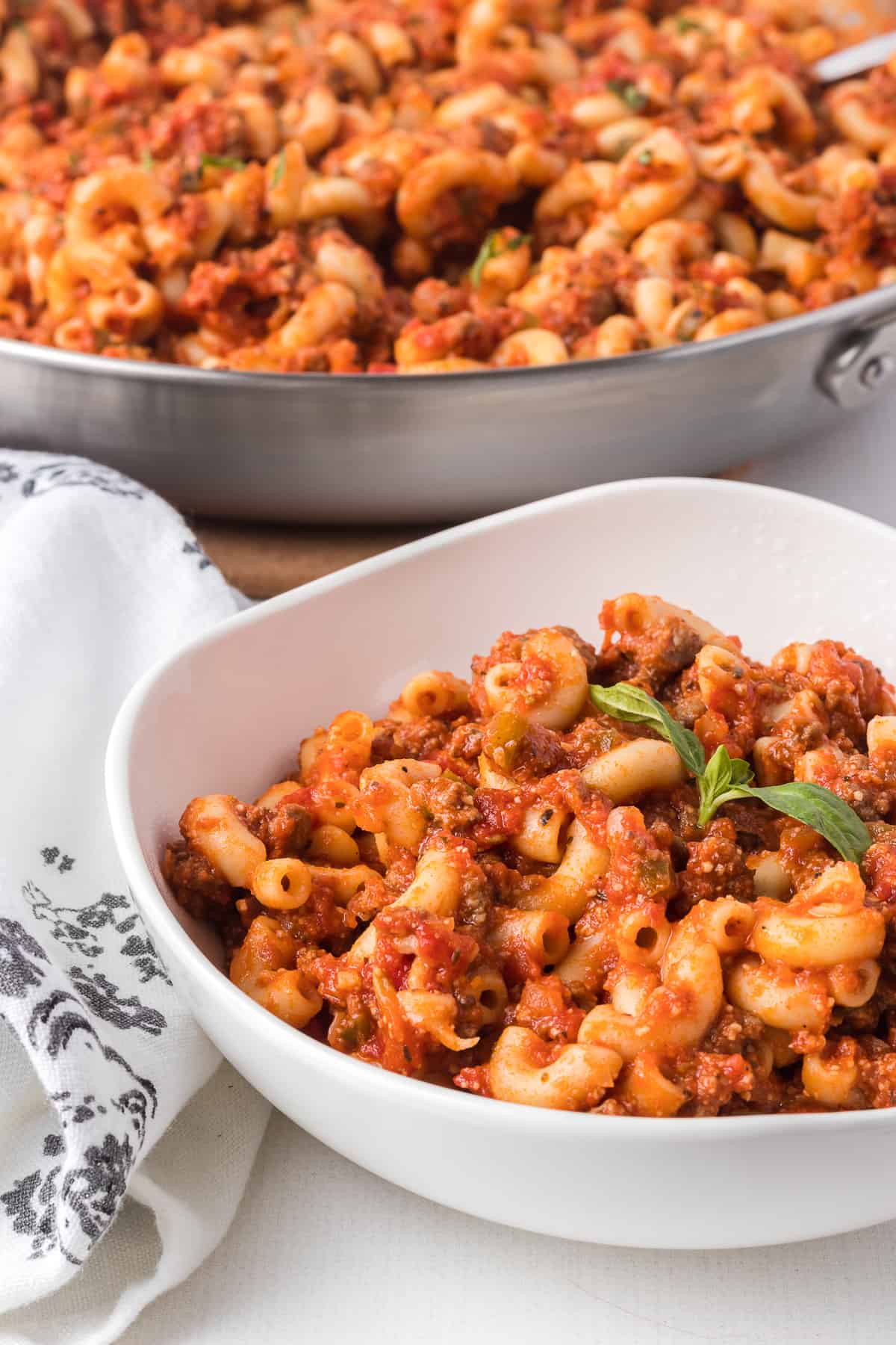 Cooked macaroni with tomato sauce, chopped tomatoes, onion, green pepper and Italian seasoning.