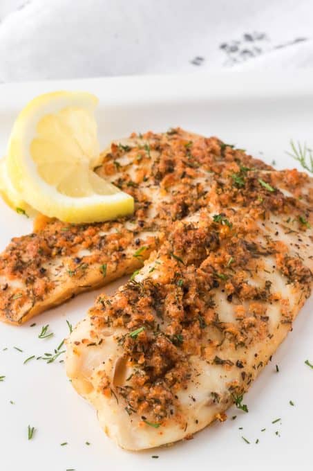 A tilapia filet that's been seasoned and steamed.