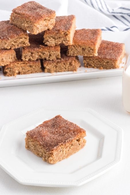 Dessert bars made of Snickerdoodle cookie dough topped with cinnamon sugar.