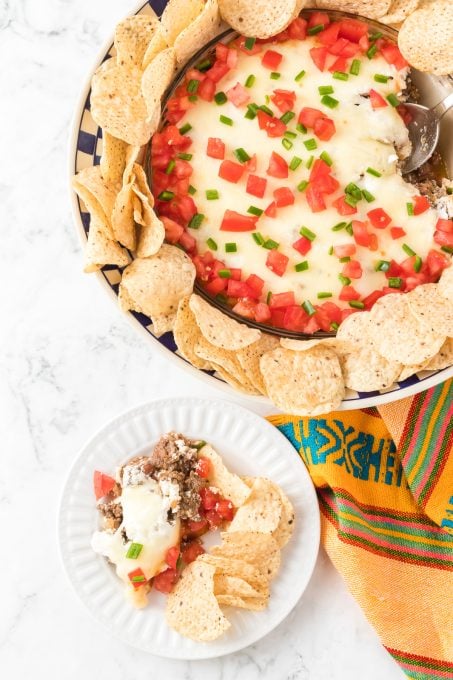 Taco seasoned beef dip with tortilla chips.