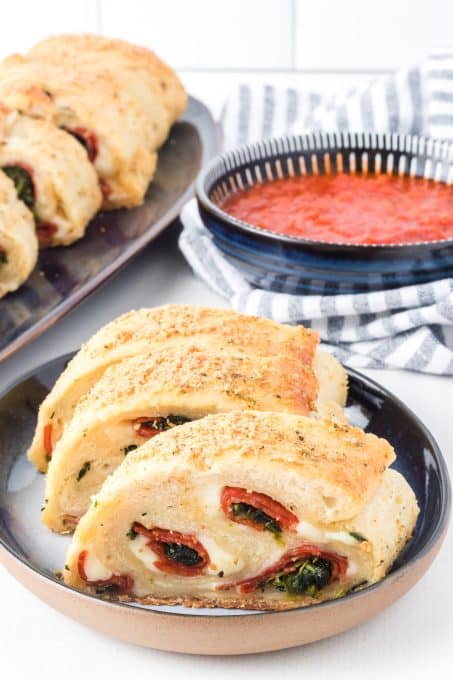 Pizza dough stuffed with spinach, pepperoni, and provolone cheese.