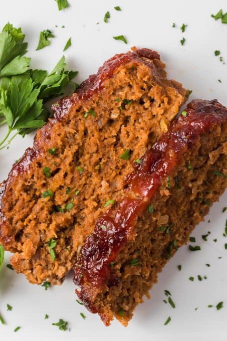 A sweet mustard and ketchup glaze top a loaf made of beef, veal and pork.