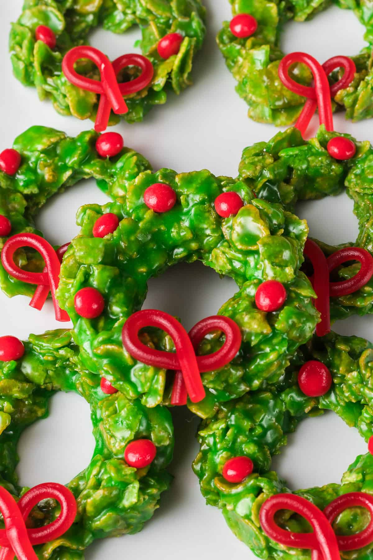 Licorice bows and red hot candy on cornflake cookies