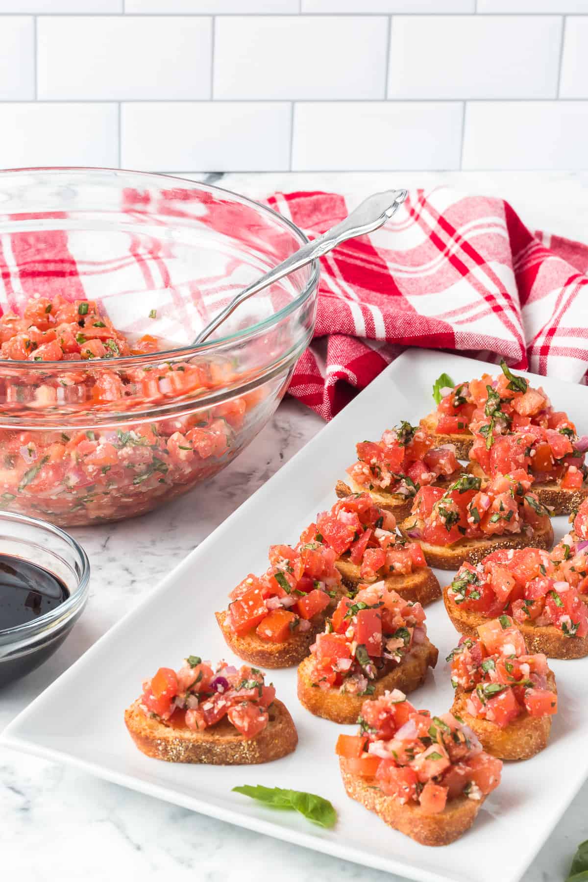 Toasted bread topped with chopped tomatoes, garlic, onion, and basil.