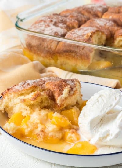 A scoop of cinnamon sugar cobbler with peaches.