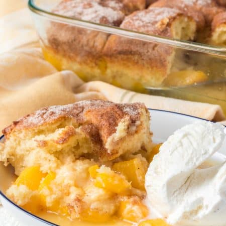 A scoop of cinnamon sugar cobbler with peaches.