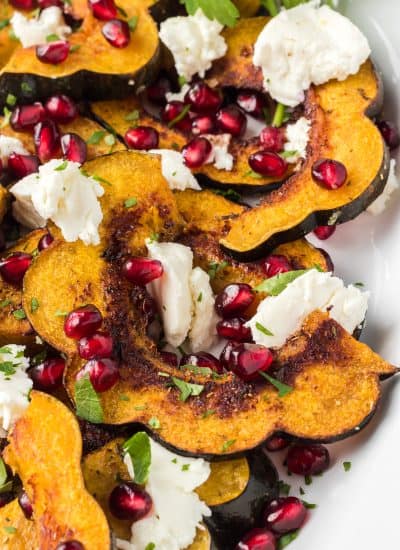 Baked acorn squash, goat cheese, and pomegranate arils.