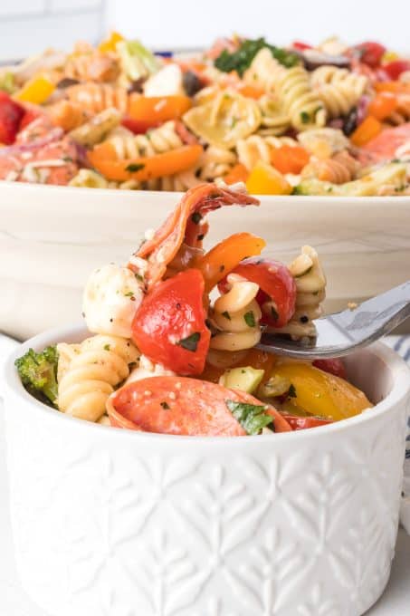 A bite of a pasta salad with an Italian flair.