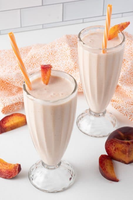 Peaches, lemon, lemonade and vanilla ice cream in a milkshake.