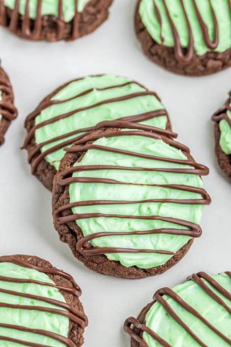 Chocolate drizzle on mint chocolate cookies.