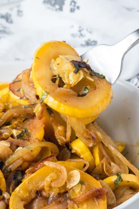 A bite of sauteed yellow summer squash.