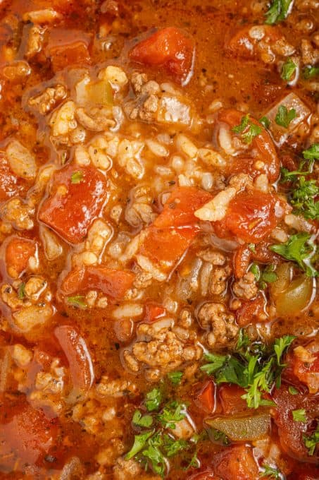 Rice, ground beef, chopped bell peppers, tomatoes and onions in a hearty soup.