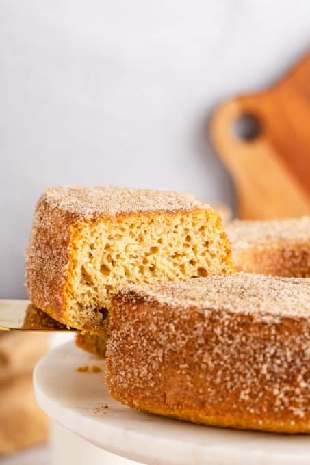 Removing a donut cake slice.