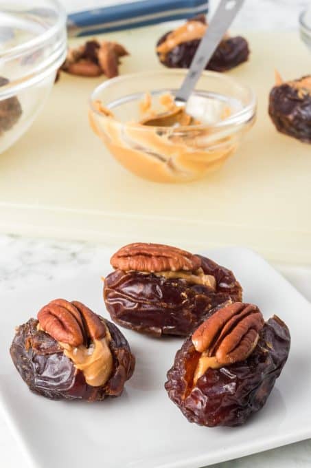 An easy snack of dates, peanut butter and pecans.