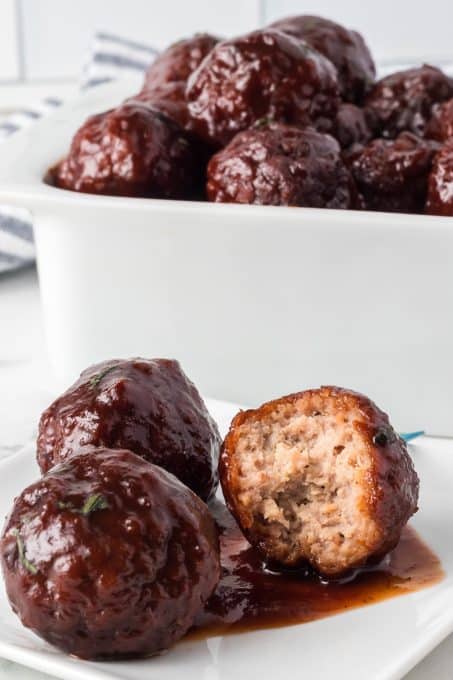 Slowcooker 3-Ingredient meatballs with grape jelly, and chili sauce.