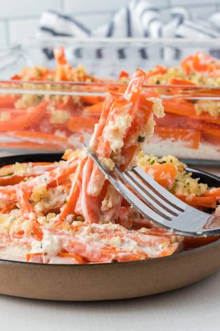 A bite of a carrot casserole with horseradish.