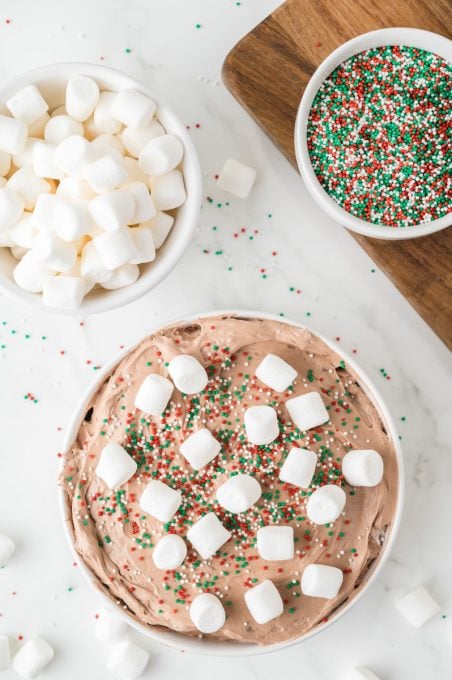 Sprinkles and mini marshmallows top a hot cocoa dip.