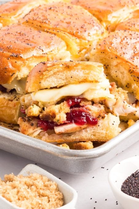 Stuffing, cranberry sauce, turkey and cheese sliders.