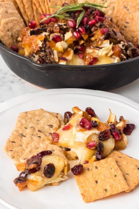 Dried fruit, nuts and brie with crackers.