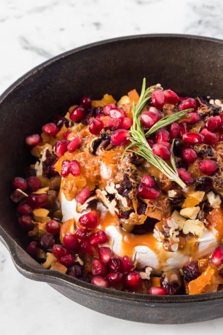 Dried fruit, nuts, and butterscotch sauce with Brie.