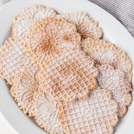 Cinnamon sugar dusted Italian waffle cookies.