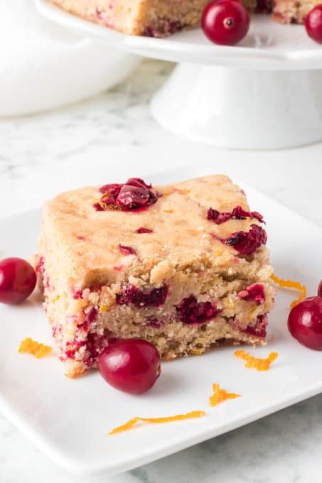 Orange blondies with chopped cranberries.