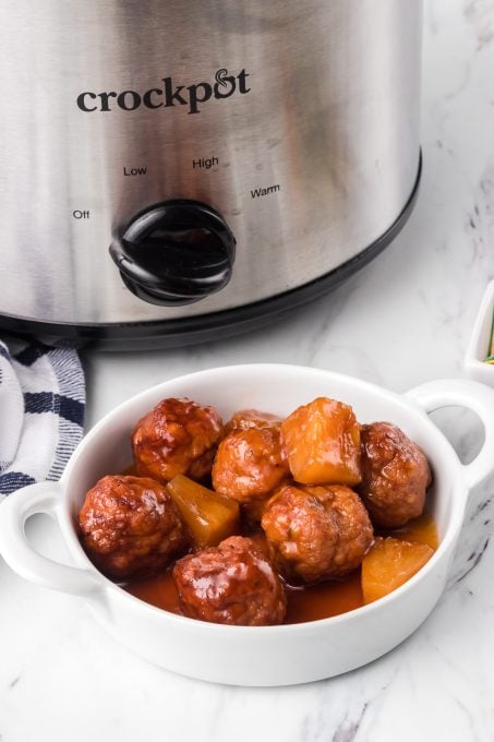 A party meatball appetizer with sweet and sour sauce.