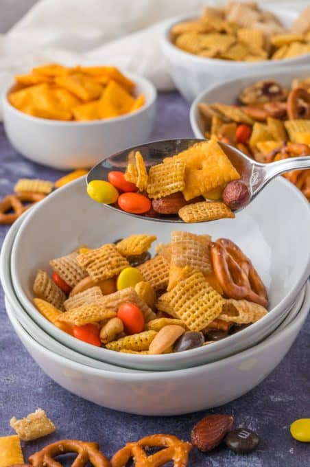 Crackers, pretzels, candy and cereal mixed together for snacking.